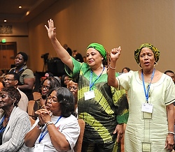 WOMEN SHOW EXUBERANCE DURING GOSPEL CONCERT AT NATIONAL BLACK CATHOLIC CONGRESS