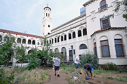 MISSIONARIES CLEAN UP COURTYARD OF FORMER CONVENT NOW HOME TO VOLUNTEERS WHO WILL HELP DENVER'S HOMELESS