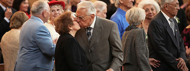 COUPLE KISSES AFTER RENEWING MARRIAGE VOWS AT LOS ANGELES CATHEDRAL