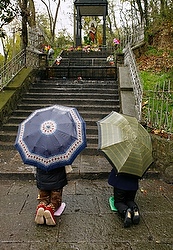 Women pray under umbrellas at shrine dedicated to Our Lady of Sheshan in China Women pray under umbrellas at shrine dedicated to Our Lady of Sheshan in China