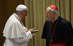 Pope Francis talks with Cardinal Erdo before start of afternoon session on first working day of extraordinary Synod of Bishops on the family at Vatican