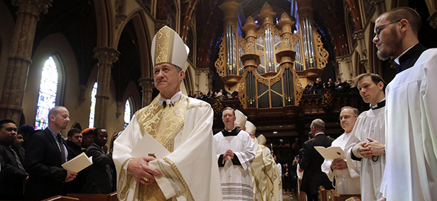 Archbishop Cupich down center aisle of Holy Name Cathedral in Chicago at start of installation Mass