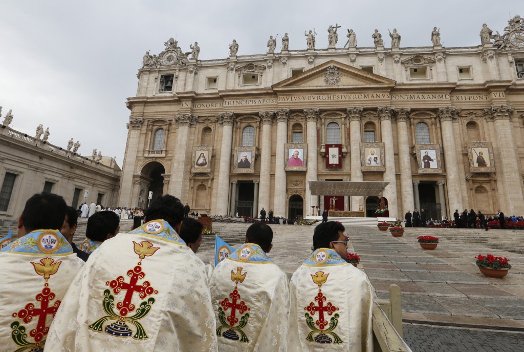 Pilgrims wait for start of canonization Mass of six new saints in St. Peter's Square at Vatican