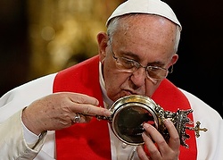 Pope Francis kisses relic of St. Januarius during meeting with religious at cathedral in Naples