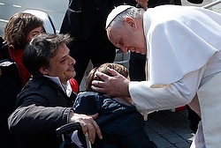 Pope Francis greets people in wheelchairs during general audience in St. Peter's Square