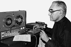 Archbishop Oscar Romero of San Salvador is seen in undated photo working in improvised radio studio