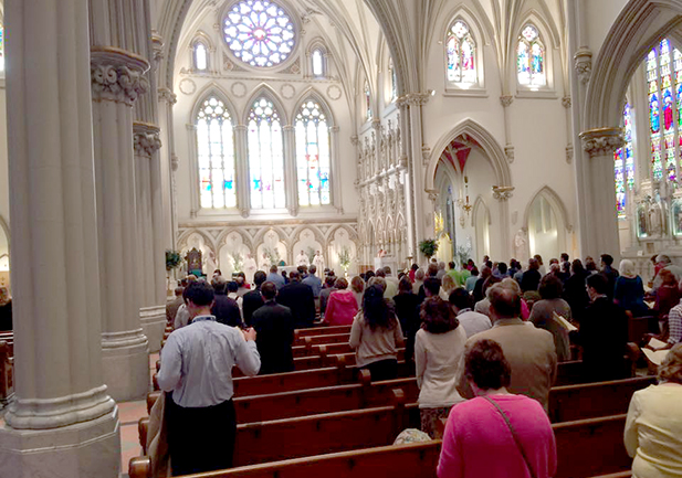 Attendees of the Catholic Media Conference worship at the opening night Mass at St. Joseph's Cathedral. Mass was celebrated by Bishop Richard J. Malone. (CT Photo/John Stegeman)