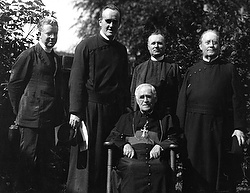 Paulist priests pose for this 1913 photo with Toronto Archbishop Neil McNeil, who is seated, on the campus of the University of Toronto. Without enough priests, the U.S.-based Paulists have decided to leave Canada after a century of ministry. (CNS photo/courtesy of the Paulists)