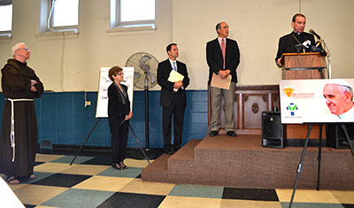 Archbishop of Cincinnati Dennis M. Schnurr, right, speaks during a press conference concerning the encyclical Laudato Si. From left are the other scheduled speakers; Franciscan Father Al Hirt, Joanne Gerson, Jeff Bohrer, Dan Misleh and Archbishop Schnurr. (CT Photo/John Stegeman)