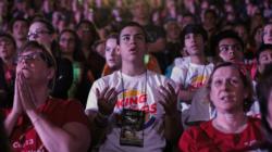 Participants and youth leaders pray during Mass Aug. 8 at the Steubenville NYC youth conference at St. John's University in the Jamaica section of the New York borough of Queens. More than 1,800 teenagers attended the Aug. 7-9 event. (CNS photo/Gregory A. Shemitz)
