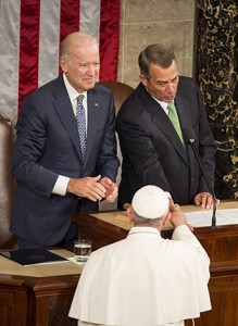 Pope Francis shakes hands with U.S. Speaker of the House John Boehner as U.S. Vice President Joe Biden looks on during a joint meeting of Congress on Capitol Hill Sept. 24 in Washington. (CNS photo/Joshua Roberts)