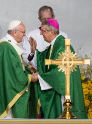 Pope Francis greets Dublin Archbishop Diarmuid Martin during the closing Mass of the World Meeting of Families on Benjamin Franklin Parkway in Philadelphia Sept. 27. The 2108 World Meeting of Families is to be held in Dublin. (CNS photo/Rick Musacchio, Tennessee Register)