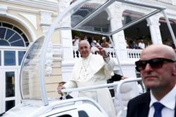 Pope Francis waves from his popemobile as he arrives at the Cathedral of Our Lady of the Assumption in Santiago, Cuba, Sept. 22.