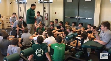 McNicholas high school football players listen to head coach Mike Orlando after completing the SportsLeader Stations of the Cross workout. (Screen shot)