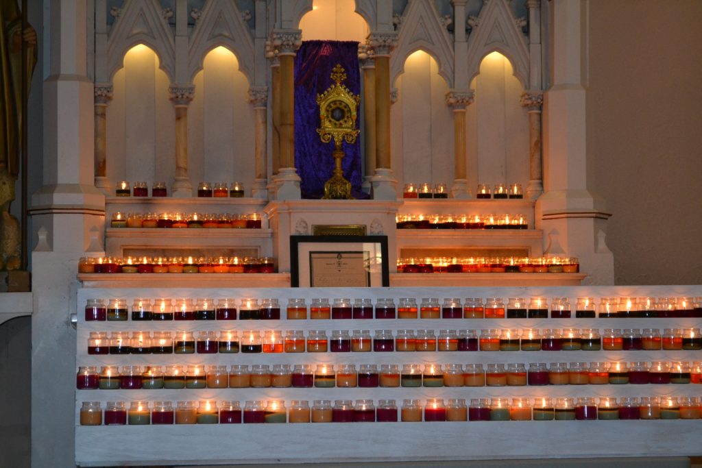 Upon entering the church, pilgrims left lit candles inn the sanctuary (CT Photo/Greg Hartman)