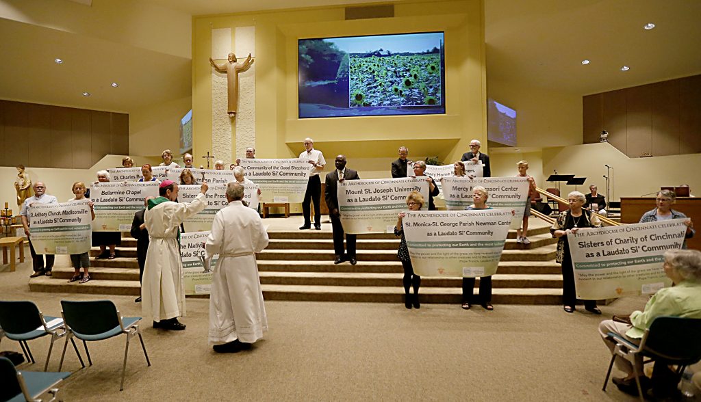 Archbishop Dennis Schnurr blesses with Holy Water the communities and the parish during the first annual Laudato Si’ Community recognitions ceremony at Good Shepherd Church in Cincinnati Monday, June 18, 2018. (CT Photo/E.L. Hubbard)