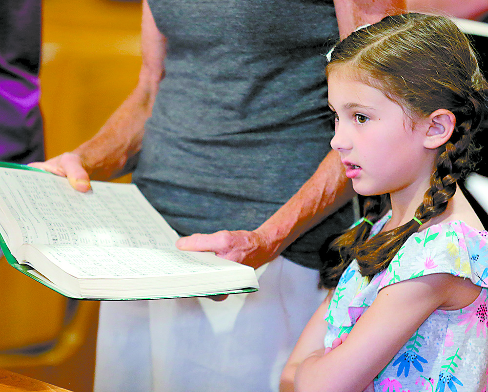 Paisley Wanamaker, 5, sings during the St. Aloysius Parish 150th Anniversary Mass in Shandon Saturday, June 2, 2018. (CT Photo/E.L. Hubbard)