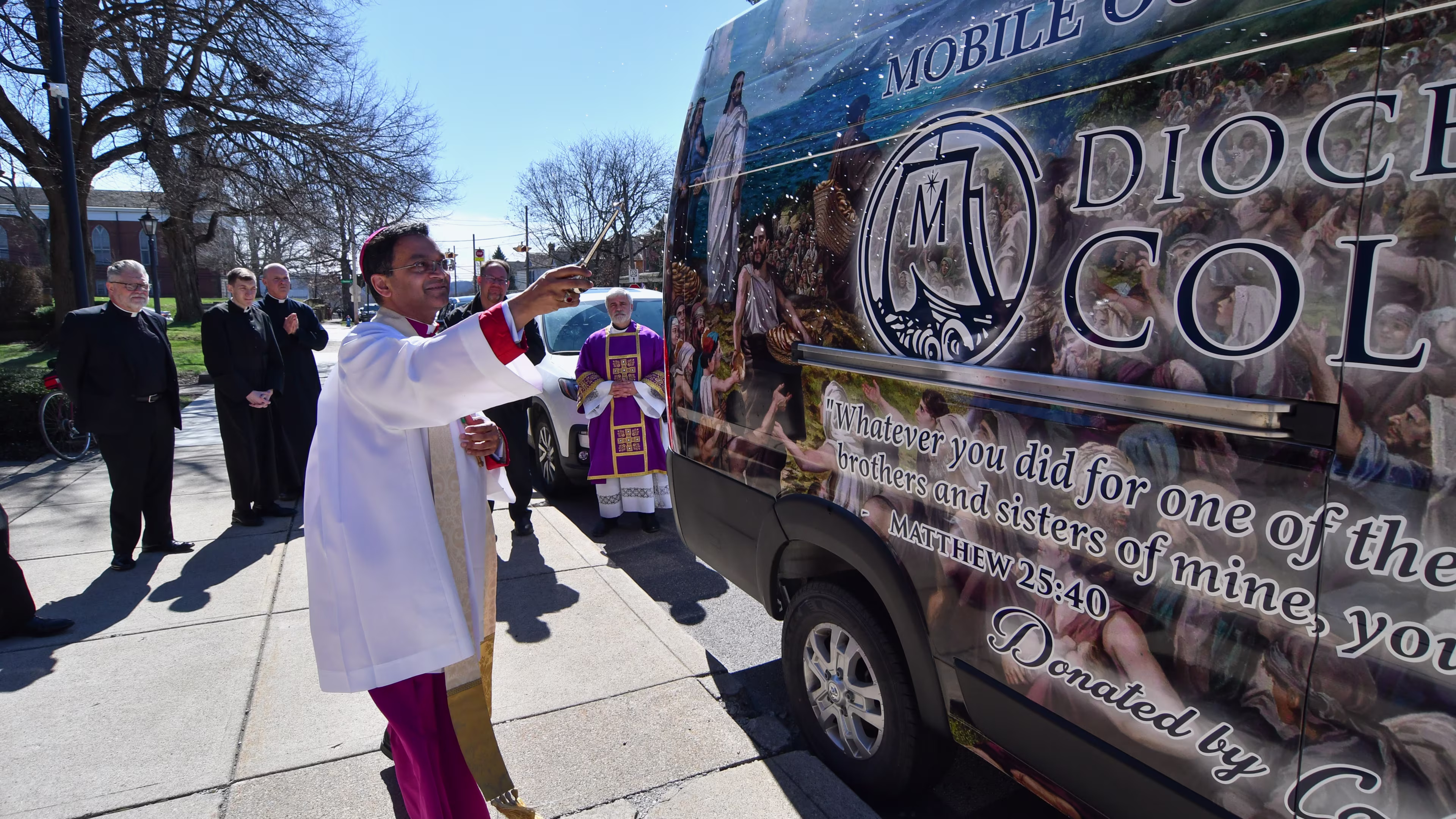 Bishop Earl Fernandes of the Diocese of Columbus, Ohio, blesses the new mobile outreach ministry van outside of the Basilica of St. Mary of the Assumption on Sunday, March 8 in Lancaster, Ohio. | Credit: Ken Snow, courtesy of the Diocese of Columbus